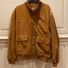 This Beautiful Jacket Is Made With Buttery Suede/Leather Caramel Color. Double Button At Lower Hem Button Closure Front Pockets One Interior Pocket Fully Lined Knitted Collar Sleeve Hem And Bottom Hem Brown Track Jacket With Pockets For Fall, Brown Winter Track Jacket With Pockets, Winter Brown Track Jacket With Pockets, Knitted Collar, Caramel Color, Suede Jacket, Suede Leather, Caramel, Mens Jackets