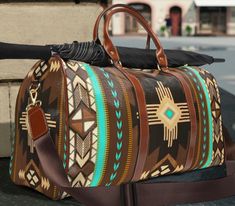 This southwestern style travel bag is all about style. Our country western duffle bag is made with high-grade waterproof fabric, it's a highly durable means of transferring your essentials wherever you go. Our cowgirl Weekender luggage tote bag has multiple compartments, a resilient carrying handle, and an adjustable shoulder strap, it's the perfect companion for all your adventures. This boho tribal Indian turquoise style design will have everyone asking where you got it, great gift for any cow Bohemian Brown Weekender Bag For Weekend Trips, Bohemian Large Capacity Duffle Bag For Weekend Trips, Bohemian Brown Duffle Bag For Weekend Trips, Bohemian Brown Weekender Bag For Travel, Brown Bohemian Weekender Bag For Travel, Brown Bohemian Weekender Bag For Overnight Trips, Bohemian Brown Weekender Bag For Overnight Trips, Bohemian Duffle Bag With Large Capacity For Trips, Bohemian Brown Duffle Bag For Travel