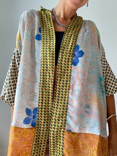 This is very bright and colurful summer free size blouse with wide kimono sleeves,  loose and light, makes very to easy to wear blouse, as a cover up  made in soft silky material, with strong colours, patchwork style,  fits all,  great for summer holiday, vacation, beach or as party outfit free size (plus) Please check also  https://www.etsy.com/shop/AltheaStores? Thank You for looking Bohemian Long Sleeve Kimono With Vibrant Print, Spring Beach Patchwork Blouse, Festival Silk Kimono With Flowy Fit, Spring Beach Lagenlook Blouse, Lagenlook Patchwork Blouse For Summer, Summer Patchwork Lagenlook Blouse, Bohemian Patchwork Blouse For Spring, Bohemian Spring Blouse With Patchwork, Bohemian Spring Patchwork Blouse