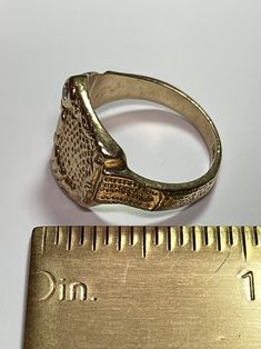 . So much texture here! 14k 1950s asymmetric signet ring. One side is a flower. This would be equally great on a man or a woman. Almost an abstract buckle. Set with an approximately 0.04 carat round brilliant cut diamond J-K I1. Incredibly comfortable and nice weight. 8.77 grams 14k yellow gold Size 9 1/4 Rectangular 14k Stamped Signet Ring Collectible, Classic Open Signet Ring Collectible, Vintage Oval Signet Ring In 14k Gold, Vintage Oval 14k Gold Signet Ring, Collectible 14k Gold Signet Ring, Antique Gold Dome Ring Stamped 14k, Antique 14k Gold Rare Signet Ring, Vintage Yellow Gold Signet Ring With Hallmarks, Vintage Gold Dome Ring With Engraving