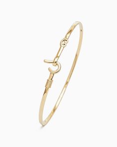 A Vibe signature, the St. John Hook Bracelet is fashioned in gently hammered 14K solid gold with a "J" hook clasp to honor the island of St. John. Featuring a replica of the St. John petroglyph and seven good luck wraps, solo or stacked, it is sure to be a favorite piece. Found in many of our designs, Vibe’s seven good luck wraps represent love, laughter, happiness, good fortune, health, unity, and peace. In the Caribbean tradition, wear your hook facing in to keep love close to your heart, and Solid Gold Bracelet, Hook Bracelet, Solid Gold Band, Gold Piece, Hook Clasp, A J, Handmade Design, Bracelet Sizes, St John