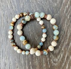 "These beautiful bracelets promote tranquility, yet are grounding. Both are made with Argentinian Lemurian Aquatine Calcite and White Fossil Jasper stone beads. One is made with 6mm beads, the other with 8mm beads. The blue green banded calcite beads have different patterns throughout with a brown matrix, making them a perfect fit with the off-white fossil jasper beads and copper accents. Choose your bracelet, with either 6mm or 8mm beads. Together, they make a lovely stack, but are equally beau Chalcedony Bracelet, Vintage Jewelry Ideas, Bracelet Inspo, Color Bracelet, Blue Onyx, 8mm Beads, Beautiful Bracelets, Bracelets Design, Blue Calcite