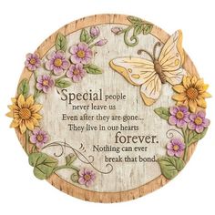 a wooden plaque with flowers and a butterfly on the front saying special people never leave us even after they are gone