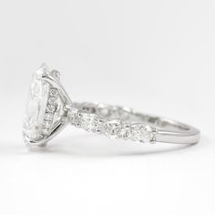 an oval cut diamond ring with side stones