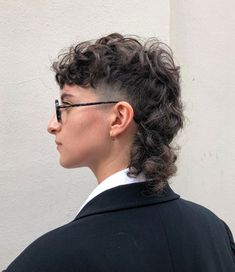 Curly Faux Hawk Mullet, Curly Mullet Shaved Sides Men, Permed Hairstyles Short Hair, Curly Shaved Mullet, Short Curly Queer Haircut, Curly Hair Mullet Shaved Sides, Short Curly Mullet Shaved Sides, Mullet With Shaved Sides Curly Hair, Medium Curly Mullet