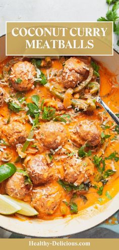 coconut curry meatballs in a white bowl with limes and cilantro