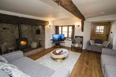 a living room filled with furniture and a fire place