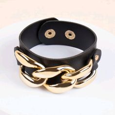 Cute Gold Chain Bracelet On A Black Faux Leather Snap Band Bracelet Measures 8.6" Long & 1.1" Wide This Item Is Included In My 5 For $25 Sale! Add This To A Bundle With 4 Other Listings Marked With A Watermelon Emoji & I'll Send A $25 Offer. If You Wish To Add More Listings, They Will Be $5. So 6 For $30, 7 For $35, Etc. B#400 Adjustable Black Chain Link Jewelry, Trendy Black Metal Chain Bracelet, Trendy Adjustable Black Chain Bracelet, Trendy Black Adjustable Chain Bracelet, Trendy Black Chain Bracelet, Trendy Black Chain Link Bracelet, Trendy Leather Party Bracelet, Edgy Bracelets With Adjustable Chain, Party Metal Bracelets With Chain Strap