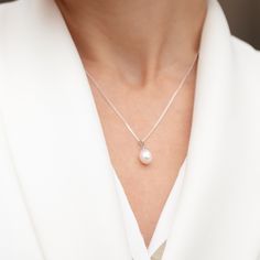 This drop shaped white pearl pendant exudes a stunning natural lustre and is suspended from 18" sterling silver diamond cut curb chain which has its own highly lustrous finish. An effortless piece of jewellery combining a timeless gem with a classic, understated design. The uncomplicated elegance of this pendant makes it ideal for weddings as well as a sophisticated, classic everyday look. Pearls are the oldest Gem known to man and have long been an emblem of modesty and purity. In Ancient Greek White Gold Pearl Pendant Necklace In Drop Shape, White Gold Teardrop Pendant Necklace With Pearl Drop, White Gold Pearl Necklace With Teardrop Pendant, White Gold Teardrop Pearl Necklace, White Gold Sterling Silver Teardrop Pendant Pearl Necklace, White Gold Sterling Silver Teardrop Pearl Necklace, Sterling Silver White Gold Teardrop Pendant Pearl Necklace, White Gold Pearl Drop Necklace Gift, White Sterling Silver Drop Necklace With Pearl Pendant