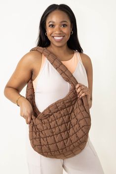 Whether for work, shopping, going to the gym, or traveling, this Large Carryall Quilted Puffer Bag for Women in Brown is the perfect accessory. Featured with a puffer quilted design and many zipper pockets, this bag is not only practical for everyday use but also super trendy and stylish! Features: KW Fashion Style: QBS320125-BROWN Color: Black 100% Polyester Featured with fashion puffer quilted design Interior zipper pocket and two other pockets Zipper pocket on both outside sides Zipper close Everyday Quilted Brown Shoulder Bag, Everyday Brown Quilted Shoulder Bag, Casual Quilted Hobo Bag For Everyday, Casual Quilted Hobo Bag, Brown Quilted Tote Bag, On-the-go Tote Shoulder Bag With Soft Interior, Casual Brown Quilted Bag, Trendy Quilted Brown Bag, Brown Large Capacity Shoulder Bag For Weekend