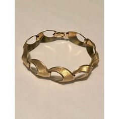 This is part of Chairish’s Fine Jewelry assortment.  This lovely 1940s Krementz 14k Gold Overlay Open Oval Link Bracelet, which comes in its original box, is a vintage piece to treasure. This traditional bracelet has nine (9) open oval links, each designed with brushed gold finish set against polished gold trim which adds depth and interest to this mid-century style bracelet. If you are a lover of sophisticated vintage jewelry, this bracelet will be a fabulous addition to your collection. It would make a fabulous gift as well.  Dimensions: 7.5"L including the clasp; approx. 1" Wide Condition: Excellent vintage condition with no wear to gold overlay (even on clasp); the clasp works very well and the links move smoothly. Please see pics for details. Original box is worn. Marks: KREMENTZ  Abo Antique Gold Hinged Bracelet For Formal Occasions, Antique Hinged Gold Bracelet For Formal Occasions, Vintage Brass Gold Bracelet For Wedding, Vintage Oval Link Gold Bracelet For Formal Occasions, Vintage Gold Bracelet With Oval Link For Formal Occasions, Vintage Gold Round Bracelet For Formal Events, Vintage 14k Gold Bracelet For Formal Occasion, Vintage Jewelry With Jubilee Bracelet For Formal Occasions, Adjustable Vintage Jewelry For Formal Occasions