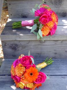 two bouquets of colorful flowers are sitting on the steps