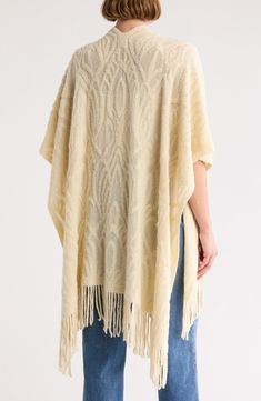 Fluttery fringe furthers the free-spirited flare of this cozy knit ruana that you'll love to layer. 44.5" length (one size) 100% acrylic Hand wash, line dry Imported One Size Knit Poncho With Fringe, Bohemian Cream Poncho With Fringe, Beige Fringed Poncho Shawl, Beige Fringe Shawl Poncho, Ivory Pearl, Cozy Knit, Free Spirited, Cozy Knits, Free Spirit