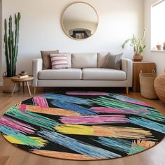 a living room filled with furniture and a colorful rug