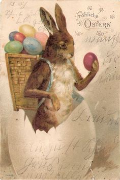 an old fashioned easter postcard with a rabbit holding an egg