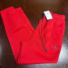 Jordan Mens Red Essentials Fleece Elastic Waist Tapered Standard Fit Sweatpants Brand: Jordan Department: Men Size: M, Xl, Xxl Color: Red Type: Pants Style: Sweatpants Pattern: Solid Theme: Sports Occasion: Activewear Season: Fall, Winter Features: Elastic Waist, Pockets Condition: New With Tags I Offer Discounts For All Return Customers. - Jvs Red Relaxed Fit Joggers For Loungewear, Red Cotton Joggers With Relaxed Fit, Red Relaxed Fit Cotton Joggers, Red Cotton Relaxed Fit Joggers, Red Cotton Joggers For Loungewear, Casual Red Joggers For Fall, Relaxed Fit Red Sweatpants With Pockets, Red Pants For Winter Streetwear, Red Relaxed Fit Sweatpants With Pockets