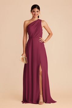 a woman in a purple one shoulder dress