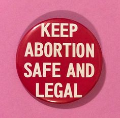 a red button that says keep aborttion safe and legal on it against a pink background