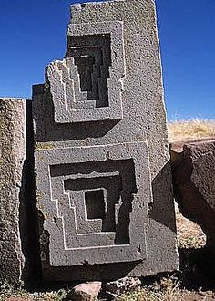 some rocks that have been carved into the shape of squares and rectangles on them