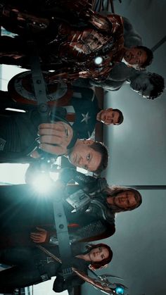 the avengers team is posing for a photo