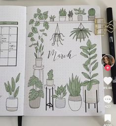 an open planner with plants on it