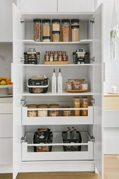 an organized pantry with lots of food in it