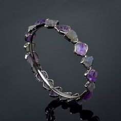 GemFormingStudio D E T A I L S Amethyst & Labradorite Bangle | Rough Stone Bangle | Gemstone Bangle | Handmade Bangle | Brass Bangle | Brass Jewelry | New Design | Gift For Women ( GFS4465 ) Stone Size : 12x11 mm ( Approx ) Weight : 23.00 gm Bangle Size : All Size Available Color : Multi Color Material : Brass Polish : All Polish Are Available . Contact us for wholesale prices. R I N G S https://www.etsy.com/in-en/shop/GemFormingStudio?section_id=22783374 B E A D S https://www.etsy.com/in-en Wedding Bangle Bracelets With Natural Stones, Wedding Bangle Bracelet With Natural Stones, Adjustable Faceted Jewelry Bracelet, Adjustable Round Spiritual Bangle, Purple Round Bracelets For Anniversary, Adjustable Natural Stone Beaded Bracelets For Wedding, Adjustable Stackable Crystal Bracelet, Adjustable Stackable Round Crystal Bracelet, Adjustable Stackable Round Bracelets