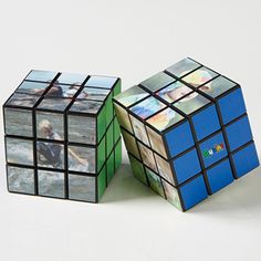 two rubik cubes with pictures on them sitting next to each other in front of a white background