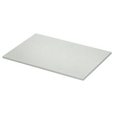 a white cutting board on a white background