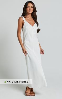 Get ready to turn heads in the Mikella Midi Dress! This stunning shift dress is made from a blend of cotton and linen, making it perfect for those hot summer days. The exposed seam detailing adds an extra touch of style, while the V neck and sleeveless design keep things casual and cool. Whether you're heading out for brunch or attending a garden party, this white midi dress will have you feeling effortlessly chic. So go ahead, embrace your inner fashionista and rock this must-have piece from Sh Cotton Lined Midi Beach Dress, Lined Cotton Midi Beach Dress, Lined Cotton Midi Dress For Beach, White Unlined Cotton Maxi Dress, Chic Cotton Unlined Maxi Dress, Unlined Cotton Dress For Brunch, Cotton Unlined Dress For Brunch, Chic Unlined Cotton Maxi Dress, Elegant Cotton Midi Dress Unlined