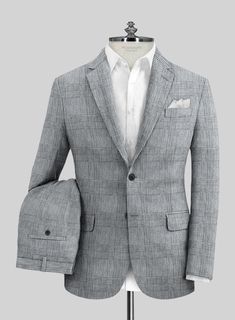 Emerge as the cynosure of all eyes by donning our Italian Linen Tovia Suit. Exquisitely tailored from the finest pure linen, this suit features a sophisticated blue-gray hue adorned with a subtle plaid motif, seamlessly blending classic elegance with a touch of modern flair. It offers both a distinguished appearance and exceptional comfort, making it ideal for any occasion where standing out is essential. Whether you're asserting a commanding presence or exuding effortless sophistication, this suit guarantees you will captivate the room with grace and confidence.   Look features a 2 button jacket with notch lapels, horn royal black buttons, single vent, three cuff buttons and two welted back pockets on trousers.   Click 'Customize Now' to modify the look if needed.   Lining: Viscose. Plaid Linen Blazer With Notch Lapel, Tailored Plaid Linen Blazer, Tailored Linen Plaid Blazer, Formal Plaid Linen Blazer, Timeless Linen Formal Suits, Plaid Linen Blazer For Business, Timeless Linen Suit For Formal Occasions, Timeless Formal Linen Suit, Timeless Linen Suit