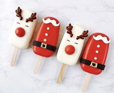 four pops decorated like santa claus and reindeer faces