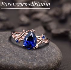 a blue ring sitting on top of a rock