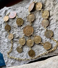 Vintage Metal Necklace With Coin Pendant, Vintage Metal Coin Pendant Necklace, Vintage Brass Coin Necklace With Coin Pendant, Vintage Brass Coin Pendant Necklace, Vintage Coin Necklaces, Vintage Metal Coin Necklace With Round Pendant, Vintage Brass Necklace With Coin Pendant, Handmade Vintage Dangle Chain Necklace, Vintage Coin-shaped Brass Necklaces