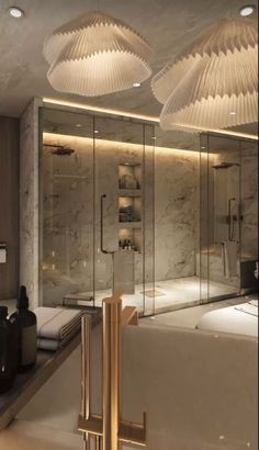 a bathroom with two lights above the bathtub