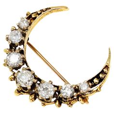 A staple of the Victorian jewelry, this crescent is a perfect example of gold craft from that period circa 1890-1900. The crescent is made in 14-karat yellow gold and features 7 graduated old mine-cut diamonds prong set. The estimated weight of the diamonds is 1.50 carats, HI color, and SI clarity. The piece has a gross weight of 4.8 grams and measures 1.16” wide. Victorian Crescent Jewelry As Gift, Victorian Crescent Jewelry For Gifts, Victorian Crescent Jewelry Gift, Victorian Crescent Wedding Jewelry, Crescent Yellow Gold Jewelry With Rose Cut Diamonds, Vintage Gold Crescent Brooch, Vintage Gold Crescent Brooches, Gold Crescent Brooch Jewelry, Vintage Crescent Brooch For Gift