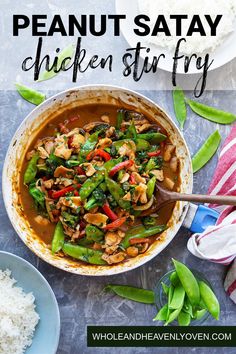 a bowl filled with chicken stir fry next to white rice and green beans on the side