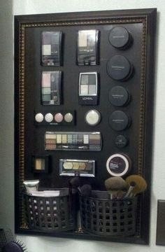 a bathroom wall mounted on the side of a wall with makeup and other items in it