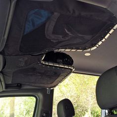 the interior of a vehicle with its sunroof open