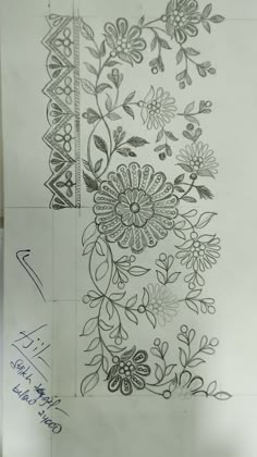 a drawing of flowers and leaves on paper