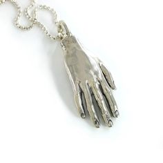 The Giant Hand Necklace is just what you'd imagine. It is a 3-dimensional (hand-carved by me!), solid cast sterling silver right hand weighing approximately 34 grams (if you aren't familiar with grams, that's a lot). The hand has a large, built-in bail, that ensures stability while providing free movement (and also allows for the chain to be switched out, if desired). The details of the hand are oxidized for greater clarity and contrast. The pendant comes strung on a beautiful sterling silver Ve Hand Necklace, Free Movement, The Hand, Box Chain, Right Hand, Handmade Natural, Hand Carved, Built In, Carving