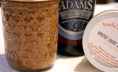 a bottle of beer next to a jar of ice cream