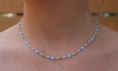 Look cute and summery with this seed bead necklace! Perfect for you or as a gift! :)  MATERIALS - 2mm seed beads, elastic cord, silver coloured lobster claw clasp LENGTH - Available in 14in, 15in, 16in, 17in, 18in, 19in, 20in and 21in! Please keep in mind every necklace is handmade and unique so the size may vary slightly :) ADJUSTABILITY - Necklace comes in 1 size only but I can add a chain extension to make it adjustable if needed! Simply message me to request this! EXTRAS - Add a circular let Cute Beaded Necklaces With Tiny Beads For Summer, Handmade Delicate Beaded Necklaces For Everyday, Delicate Handmade Beaded Necklaces, Colorful Adjustable Necklace With Tiny Beads, Playful Adjustable Blue Beaded Necklace, Playful Blue Beaded Necklace, Blue Multi-strand Necklace With Tiny Beads, Rainbow Seed Bead Necklace, Jewellery Layering