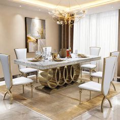 a dining room table with white chairs and a chandelier