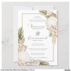 a wedding card with flowers and palm leaves