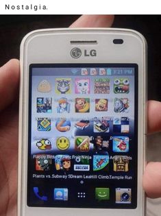 a person holding up a smart phone with icons on the front and back side of it