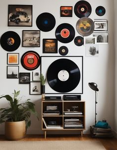 a record player sitting on top of a wooden shelf next to a wall filled with records