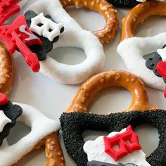 several decorated pretzels are arranged on a table