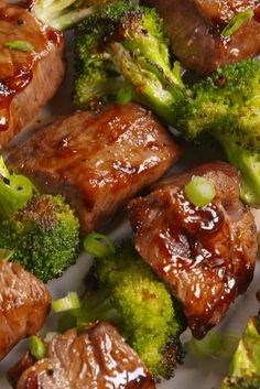 some meat and broccoli on a white plate