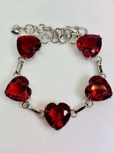 Silver Heart-shaped Chain Bracelet For Wedding, Red Jeweled Bracelets As Gift, Red Heart-shaped Metal Bracelets, Red Jeweled Bracelets For Gift, Red Bracelet Jewelry For Valentine's Day, Silver Heart Chain Bracelet For Valentine's Day, Silver Bracelets For Valentine's Day, Silver Chain Bracelet For Wedding, Red Bracelet For Valentine's Day